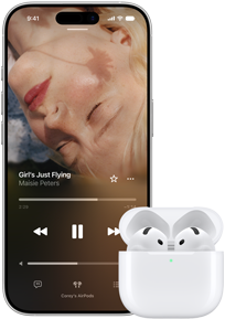 iPhone next to AirPods in charging case, case is open