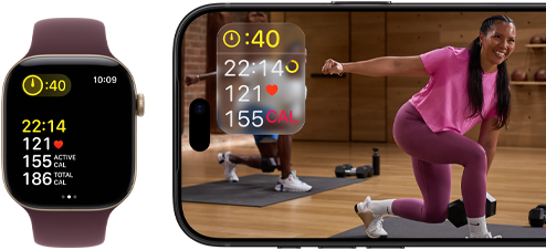 Apple Watch next to iPhone with Apple Fitness+ class on screen