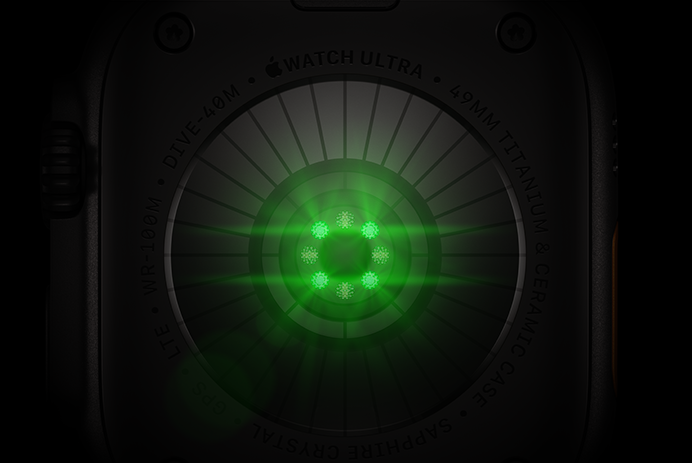 Back of Apple Watch Ultra 4, titanium case, black colour, multiple round sensors with glowing green LED lights