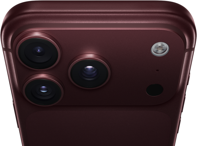 iPhone 18 Pro Max, burgundy colour (dark red), back exterior, Pro Fusion camera system at top, 3 lenses, variable aperture blades partially closed, flash, microphone and LiDAR Scanner, top exterior, cellular antenna, flat sides, rounded edges